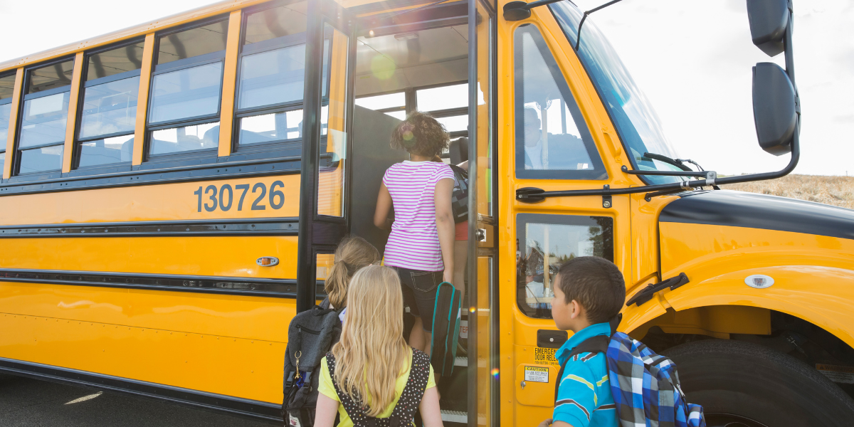 students boarding the school bus